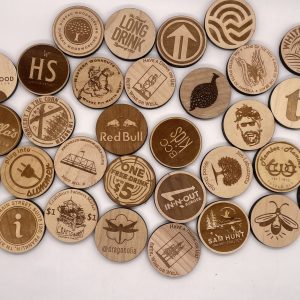 many custom wood round tokens